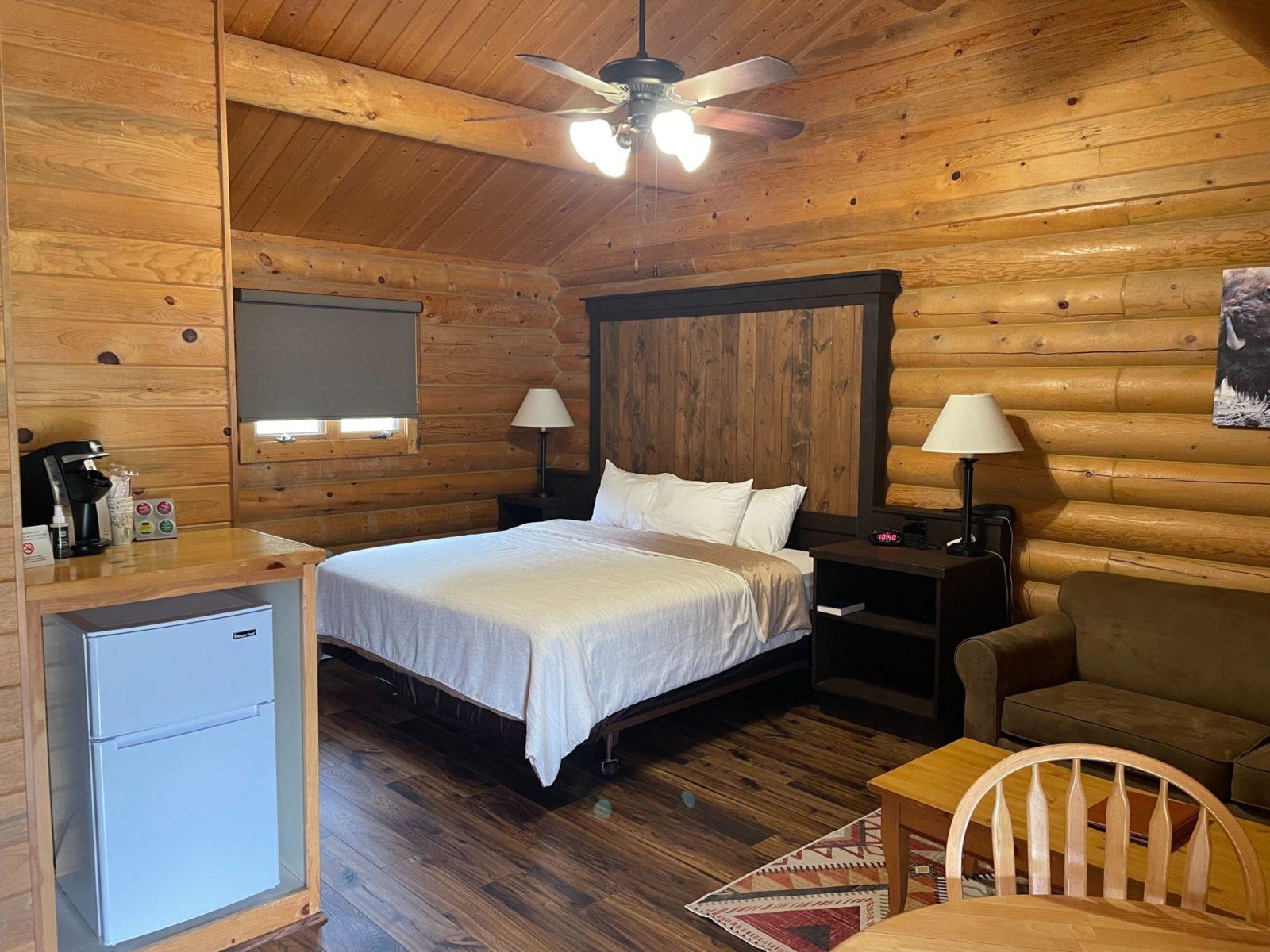 King bed of the deluxe log cabin with kitchenette