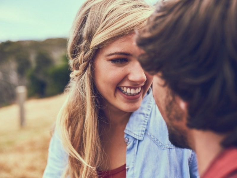 Romantic Getaways in Montana: A couple shares a smiling embrace during their Montana ranch vacation near Gallatin Gateway.